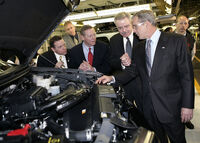 Mulally (second from left) with then-President George W. Bush at the Kansas City Assembly plant in Claycomo, Missouri on March 20, 2007,  Ford's new hybrid cars.