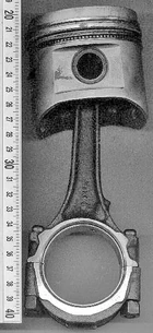 piston (top) and connecting rod from typical automotive engine (scale is in centimetres)