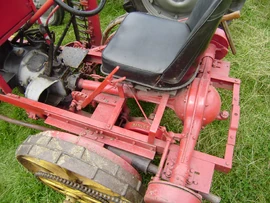 A Bamlett mower converted to self propelled by the addition of an Austin 7 car chassis, engine, gearbox and rear axle driving the mower via a chain and sprockets