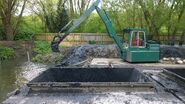 A 1990s Smalley 450 Excavator Diesel river cleaning