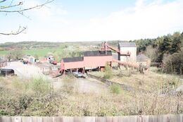 Reconstructed pitworks buildings showing winding gear