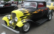 '32 3-window with a classic-style flame job and  tank, very reminiscent of ' .