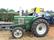 Field Marshall 3650 driving machinery via the  at a vintage tractor event