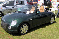 Daihatsu c. 2001 with retracted hardtop, qualifying for the ultra-compact Japanese Kei class.