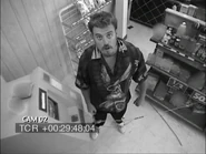 Ricky announcing the ATM theft to the security camera.