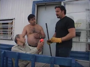 Julian trades Jim's badge for the hockey ball.