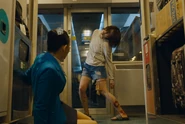 The woman transforms into a zombie infront of Min-ji