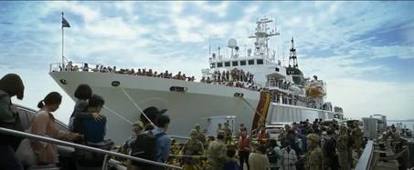South Korean military personnel evacuating civilians to a vessel