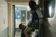 Yong-suk throws Jin-hee to the zombies and kills her