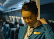 Hye-yeong adjusts her scarf