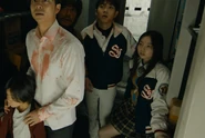 The survivors hear that the train's path is blocked