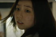 Jin-hee turns her head and sees Yong-suk running onboard