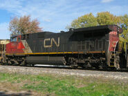 A CN (Canadian National; CN Rail) Dash 9 which is one of the several to not include an air conditioning unit behind the cab as opposed to other Dash 9 units.