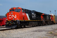 A brand-new CN ET44AC leading a Tier 3-compliant ES44AC built months prior.