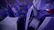 Megatron, showing annoyance at Starscream's actions.