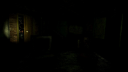 Spirit Donald at the left door, flashlight on.