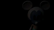 Webpnet-gifmaker-8wd7dq4u.gif (411 KB) Photo-Negative Mickey raising his head and staring at the player in the title screen if the player waits too long.