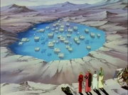 Vash and the others observing the flooded town.