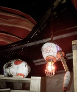 A broken Driver Assist with a large red bulb replacing its head.