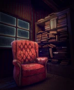 A teaser of a red chair and a bookshelf.