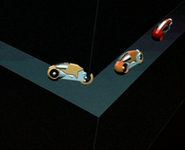 As the Tron, Ram and Flynn escape from the Game Grid, for a frame, Flynn's light cycle drives through a wall.