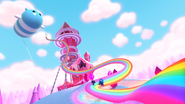 True and Bartleby slide up the rainbow-colored slide produced by Slipzy, with Zepplo nearby.