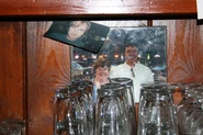 Photo of Alan Ball and Charlaine Harris behind the bar
