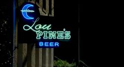 Logo of Lou Pine's as it appears above the building's entry.