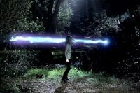 Nora is blasted by Niall's light beam.