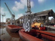 Grey cranes with green cabins