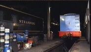 The Rainbow Sun sits in the Strasburg engine shed with Thomas