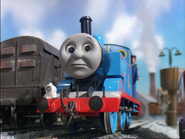 Thomas next to a utility van