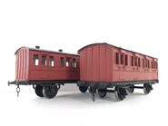 Two resin red branchline coaches owned by Twitter user TomsProps