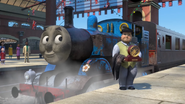 Sir Topham Hatt with Thomas after receiving his award from the Queen