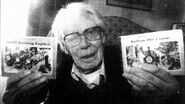 Wilbert Awdry holding a copy of the book and Small Railway Engines