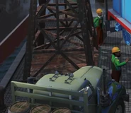 A grey and black flatbed lorry