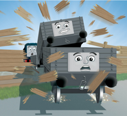 6-plank trucks bursting through a fence