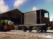 A brake van about to be hit by Percy