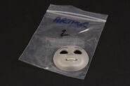 The face with its storage bag as prior to being sold
