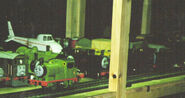 Stepney, Toby, Percy, Oliver, Henry, Harold, Donald and Douglas' models in the background (Note: Percy is wearing his shocked face and Douglas is wearing his sad face)