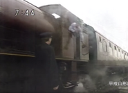 The driver handing the tablet to the stationmaster in Thomas and the U.K. Trip