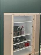 A shelf by IKEA assembled to provide storage for supplies during construction of the layout