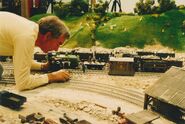 The bulldozer and a lorry in a behind the scenes picture