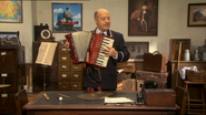 Mr. Perkins playing Mr. Arkwright's accordion