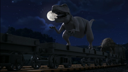 Flatbeds carrying dinosaur statues