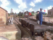 Sir Topham Hatt and his assistants standing on the flatbed