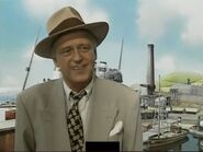 David Mitton in the real world wearing the same outfit as his fictionalised counterpart