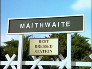 The station sign with a sign saying "Best Dressed Station"