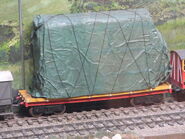 Flora's Tram Coach covered in tarpaulins