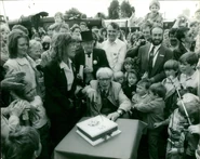 Wilbert cutting Thomas' birthday cake